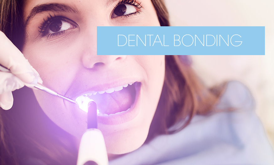 dentist repairing tooth using UV light