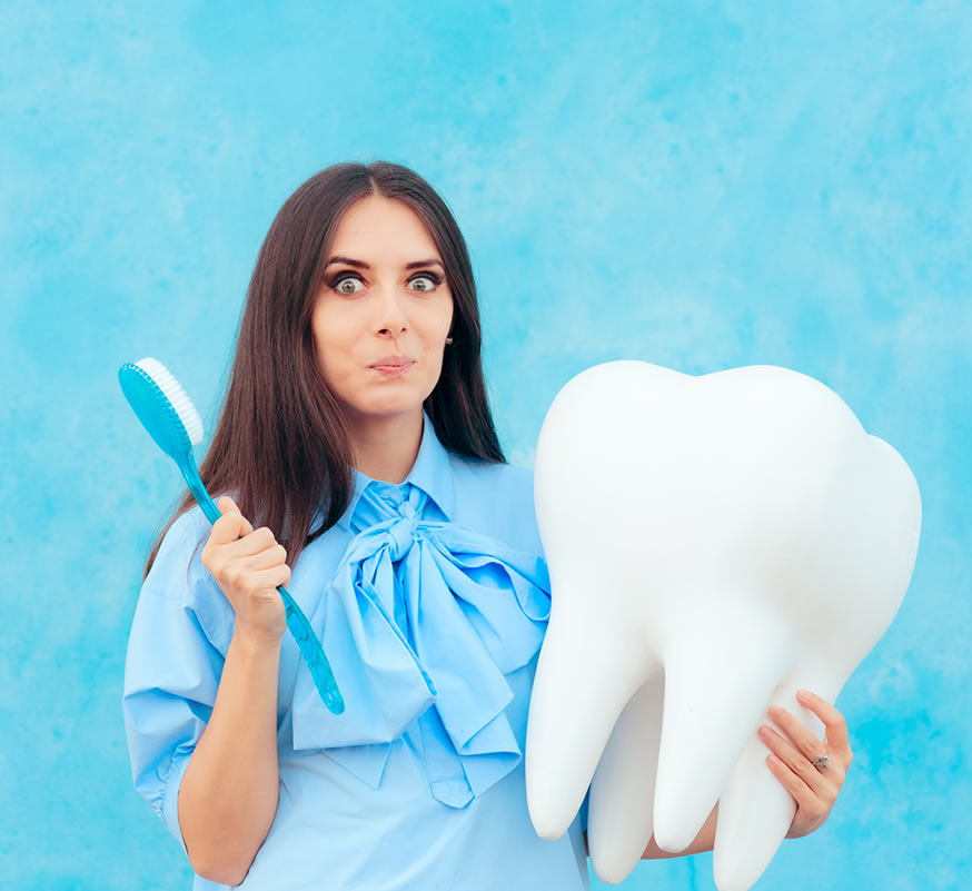woman scrubbing prop to remove tooth stains